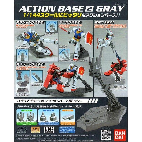 Product packaging for Bandai Action Base No.2, showing the gray display base and examples of its use with various Gundam model kits.